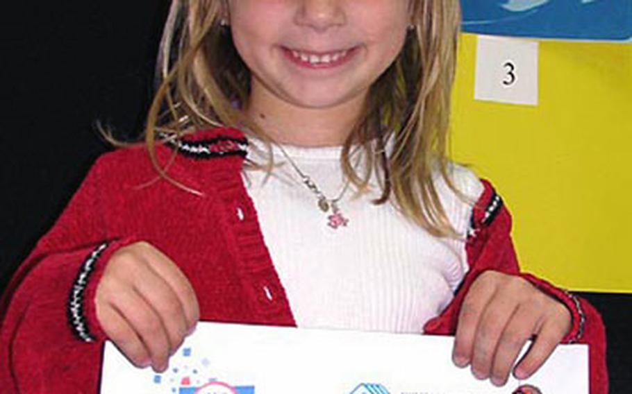 Sasebo Elementary School student Alexis Blanton displays the “Certificate of Merit” she won in March for several winning entries in the 2005 ImageMakers National Photography Contest sponsored by Sasebo Naval Base’s Morale, Welfare and Recreation department and the Boys and Girls Clubs of Sasebo.