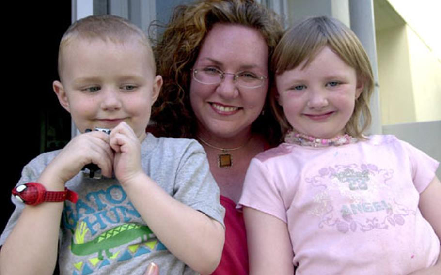 Aimee Hodgin, her daughter Gabrielle and son Montgomery are happy to be on dry land after being involved in a ferry incident off South Korea’s coast during a noncombatant evacuation exercise in April.