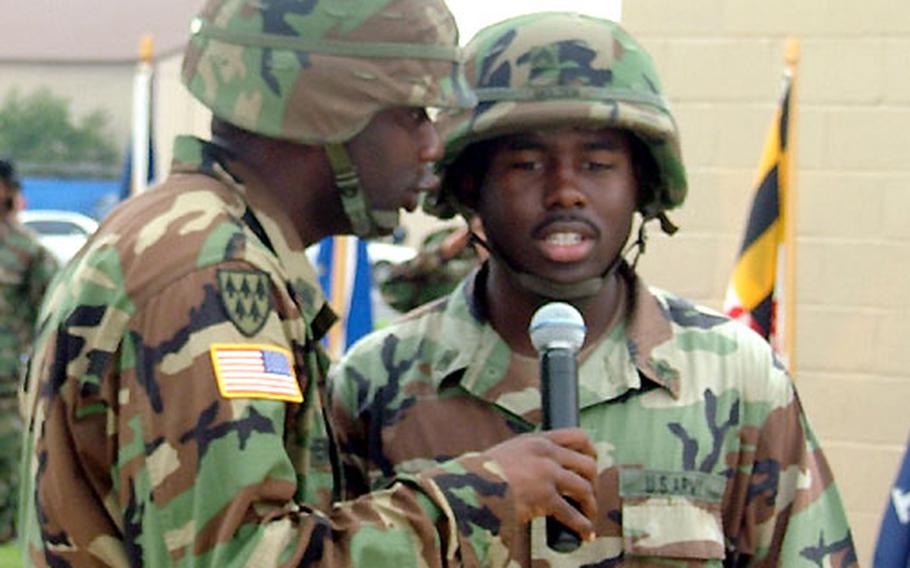 At Kwangju Air Base in South Korea, Sgt. Gerald Henderson, left, and Cpl. Perry Molden sing the national anthem a cappella at an official ceremony, something they’re increasingly asked to do. Both are assigned to Army’s Headquarters and Headquarters Battery, 2nd Battalion, 1st Air Defense Artillery Regiment, part of the 35th Air Defense Artillery Brigade.