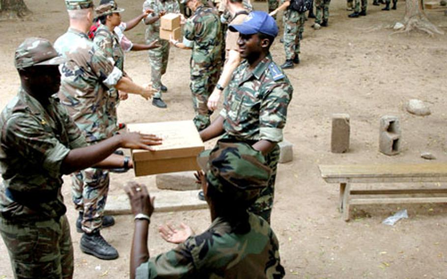 U.S. sailors and Cameroonian soldiers set up a pharmacy during the West African Training Cruise in Garoua, Cameroon. The medical exercise earlier in this month, which took place in Cameroon and Gabon, is part of the U.S. military’s decade-long mission to help 10 West African nations develop or improve their security.