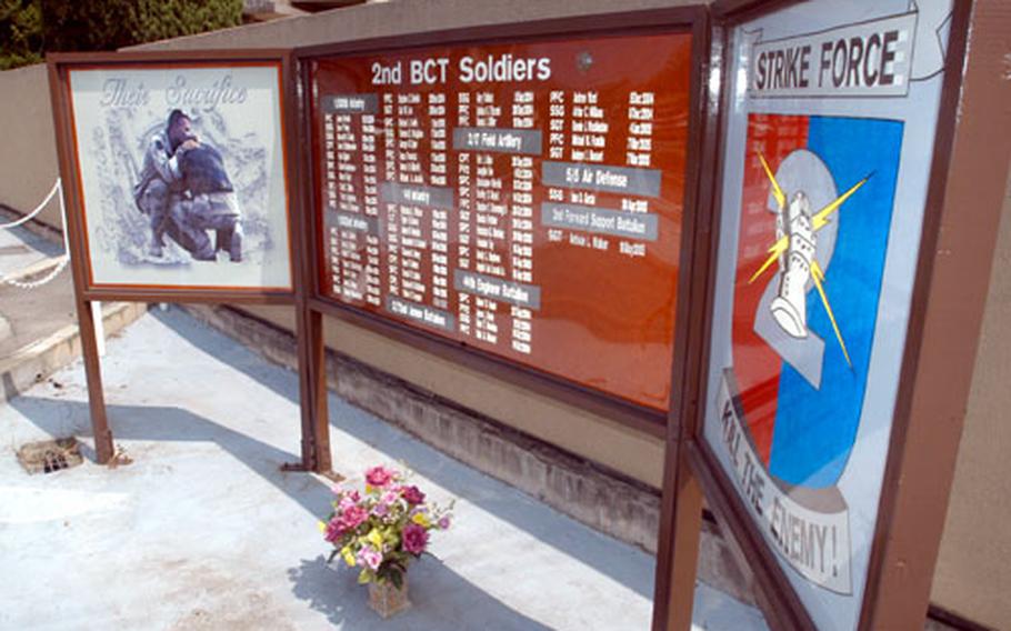 A memorial to Strike Force soldiers killed in action in Iraq stands inside the front gate at Camp Casey, South Korea. Though many Casey soldiers who knew and had grown close with the Strike Force troops have rotated out of South Korea, there was still a strong desire on the base to build a fitting memorial to their comrades’ sacrifices.