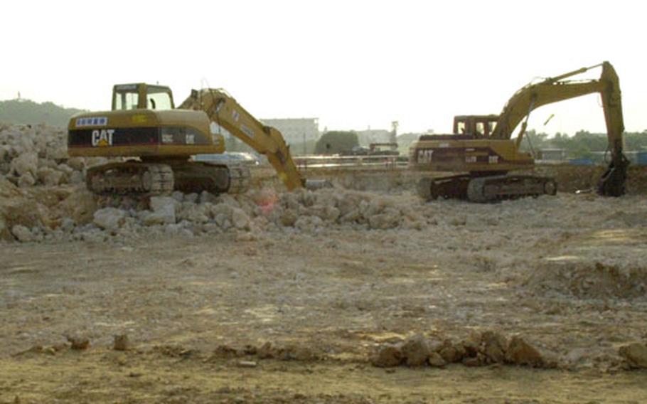 Ground is prepared for construction of a new middle school and 116 units of multi-family housing near Vincent and Fairchild Avenues on Kadena Air Base, Okinawa.