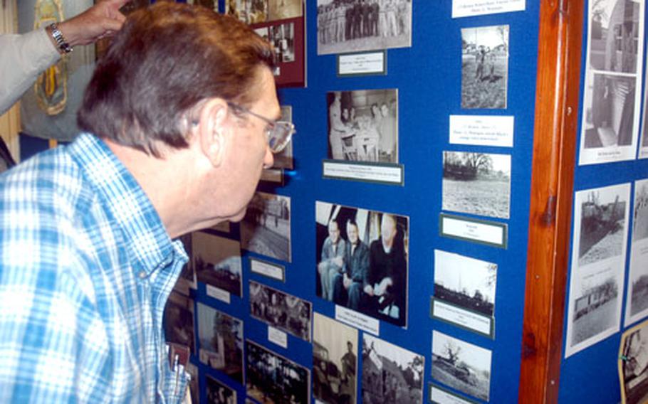 Phillip Mitchell, 67, of Milton, Wis., looks at photos in a museum Saturday from the early days of the British base known as Chicksands. Mitchell served from 1958 to 1962 and returned for a reunion.