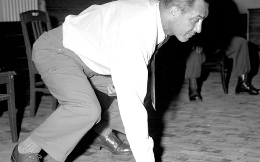Benny Friedman conducts a football clinic at Aschafenburg, Germany, in July, 1951.