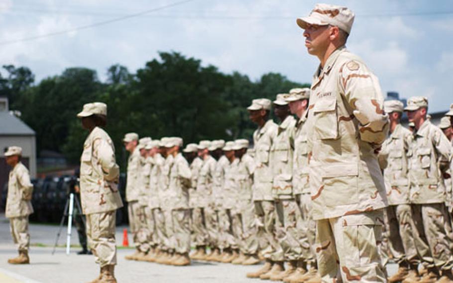 Soldiers from the 305th Quartermaster Company stand in formation for their deployment ceremony at Yongsan Garrison on Thursday.
