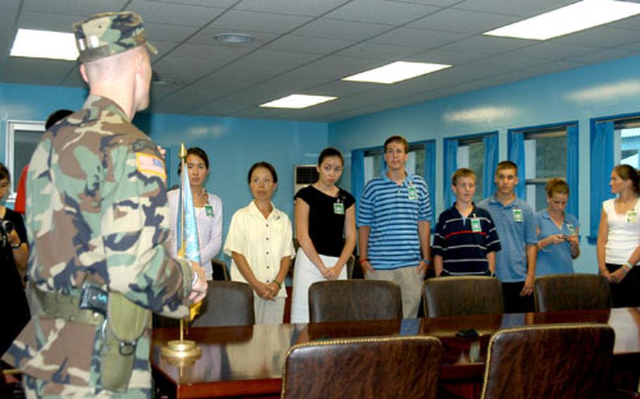 Spec. Vinny Fleming, of Sacramento, Calif., talks to students Wednesday afternoon at the Joint Security Area in the Demilitarized Zone.