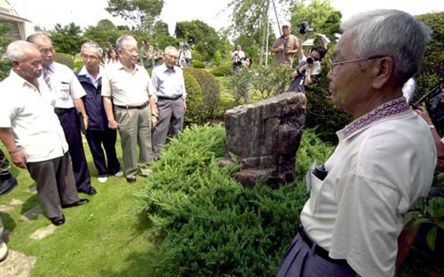 Former Japanese army pilots and maintenance personnel who worked in the 1940s at Tama Army Airfield, the predecessor of Yokota Air Base, visit the base facilities Tuesday in commemoration of the 60th anniversary of the end of the World War II.