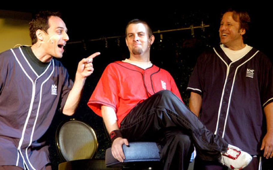 Gary Kramer, left, and Les McGehee, right, grill Dorian Lenz in a crime skit during the National Comedy Theatres performance in Darmstadt, Germany, Tuesday night. Lenz had to guess by the questions what crime he and Chris O'Neill, not pictured, were accused of.