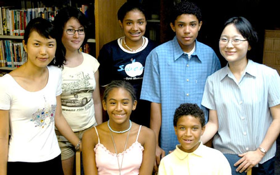 Five students from Seoul American High School and Middle School are taking part this week in youth peace walks throughout South Korea. From left: Seok Min-jin, National Youth Commission; Chelsea Ricketson, 16; Lindsey Parks, 13; Landon Parks, 14; Son Minyoung, National Youth Commission. Seated: Candice Johnson, 12; and Dominic Pacheco, 12.