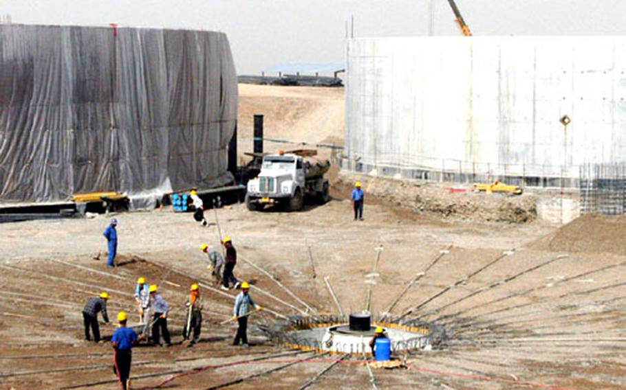 A crew works on the sixth clarifying tank at the Ifraz Water Treatment Plant. The tanks cause heavy debris in water pulled from the Zab River to settle before the water is pumped through a fine sand and charcoal filter.