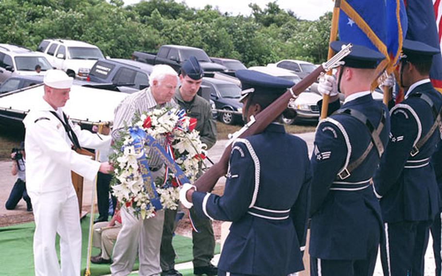 Left to right, Navy Petty Officer 2nd Class Justin Birch, WWII Navy veteran Ken Jones and Air Force Lt. Col. Paul Tibbets lay a wreath during the dedication of the monument to “The Last Mission” of the war at the Northwest Field section of Andersen Air Force Base, Guam.