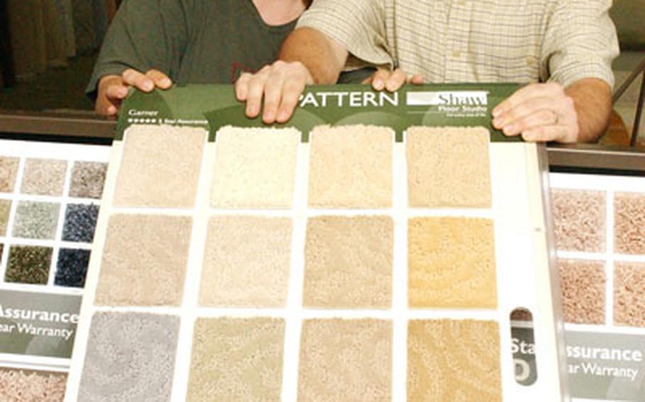 Courtesy of the St. The grand prize winner of the Great Stainmaster carpet Sweepstakes, U.S. Navy Petty Officer 1st Class James Dasilva, and his wife, Joan, select new carpet at B&K Carpet in Newfoundland, Canada.