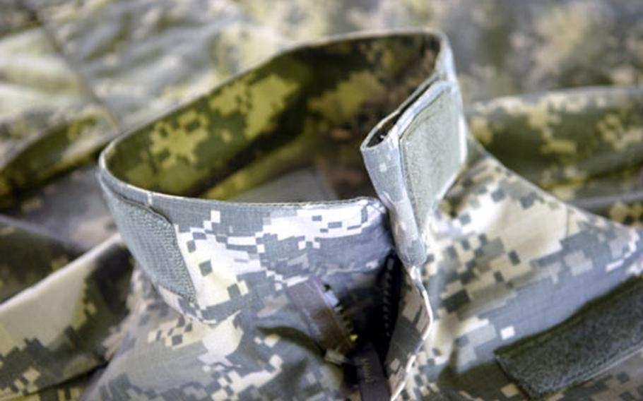 The new Army Combat Uniform feaures a Mandarin collar that is designed to be worn up or down.