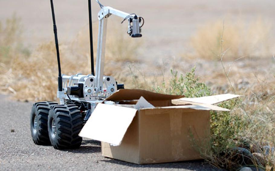 A pre-production version of the new Marcbot IV inspects a box for explosives in a manufacturer's test earlier this month. The new detectors are expected to arrive in Iraq and Afghanistan over the next three to five months.
