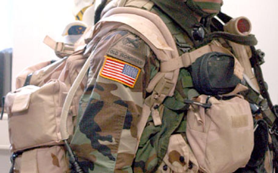 Pvt. Alfredo Alvaredo, from Company A, 1st Battalion, 35th Armored Regiment, sports the new tan aid bag issued to him just before his training rotation started at Hohenfels earlier this month.