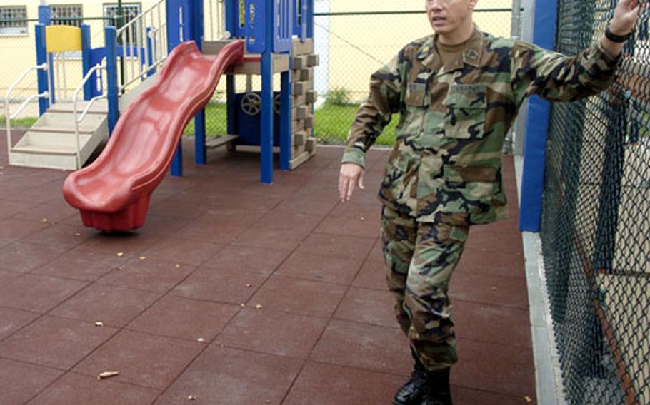 Maj. Jerry Wood, commander, 64th Replacement Company, shows off a playground at the company’s new facilities in Hanau, Germany.