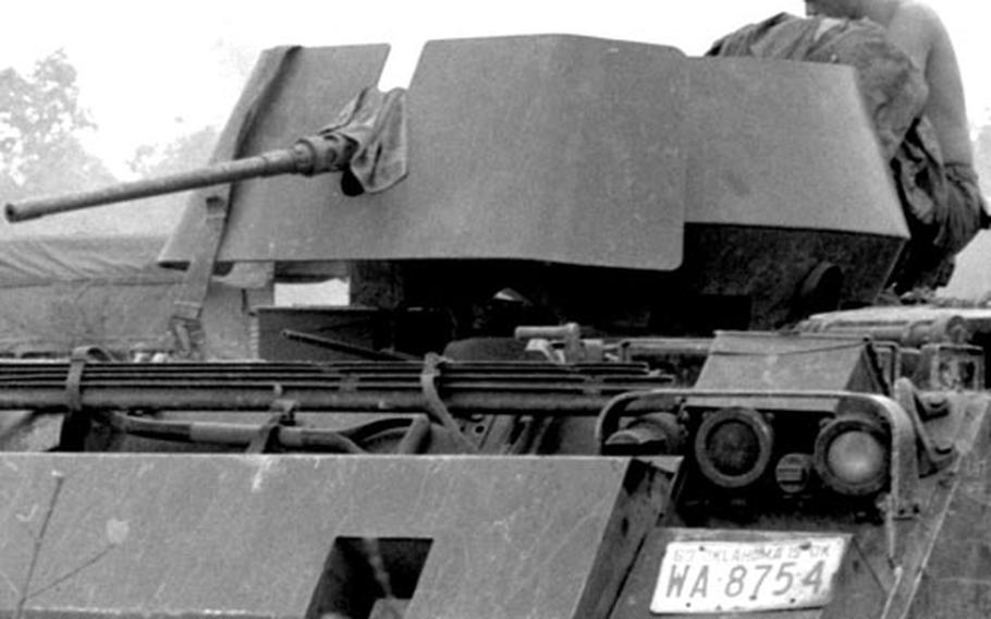An armored vehicle in Cambodia bears an Oklahoma license plate.