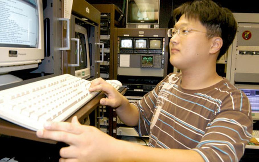 Intern Kim Jun-hwan works at a console at the American Forces Network Taegu detachment at Camp Walker in Daegu, South Korea. Kim is a sophomore at Kyungpuk National University, majoring in electrical and computer science.