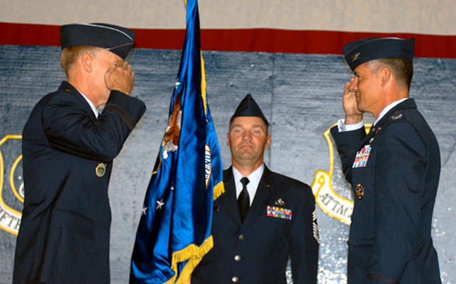 Lt. Gen. Bruce A. Wright, commander of U.S. Forces Japan and 5th Air Force, and Brig. Gen. (select) Salvatore "Sam" Angelella salute after Wright passed the guidon to Angelella, signifying his assumption of the 35th Fighter Wing's command.