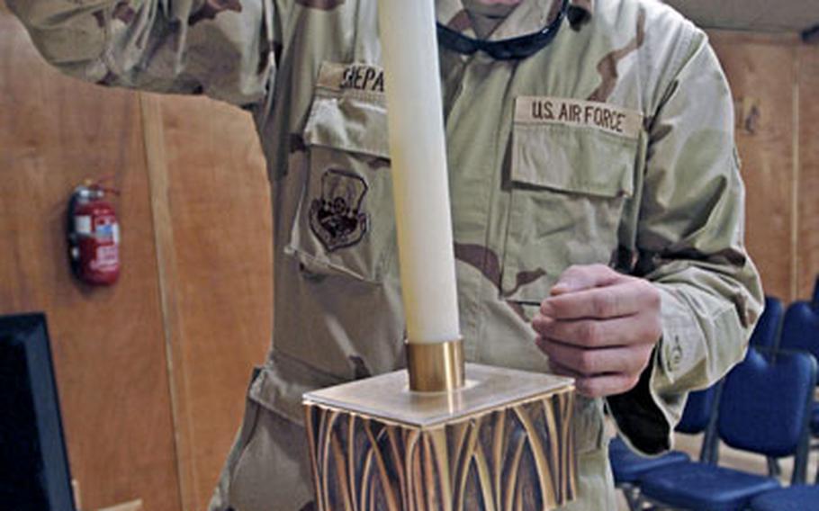 Staff Sgt. John Shepard, a chaplain assistant with the 332nd Air Expeditionary Wing, prepares for a Mass at the Tuskegee Chapel at Balad Air Base, Iraq.