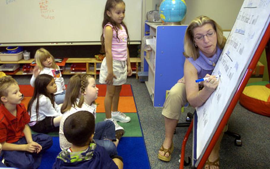 First-grade teacher Melissa Rowley-Knudtson asks her new pupils their thoughts about first grade on the first day of the DODDS school year in Darmstadt, Germany, on Monday.
