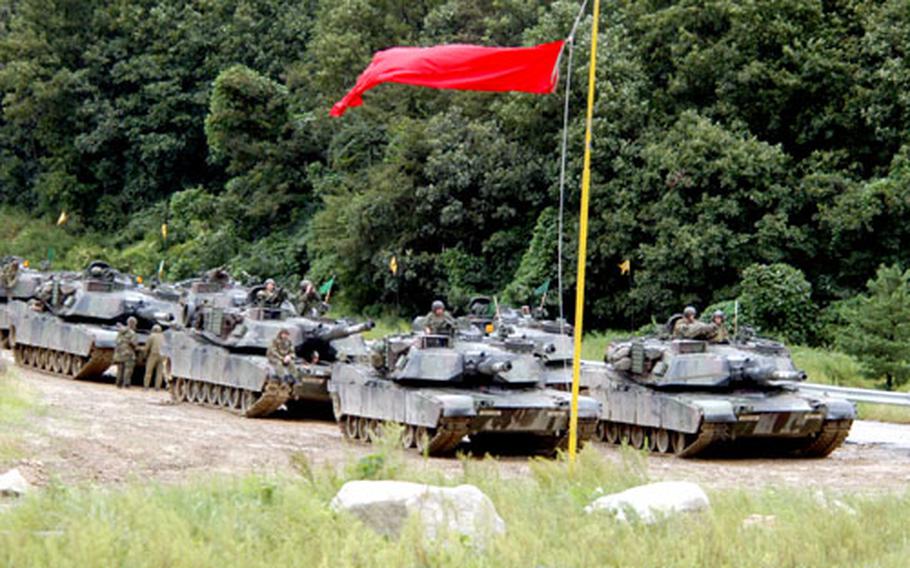 2nd Battalion, 9th Infantry Regiment tanks prepare to fire at Rodriguez Range on Thursday.