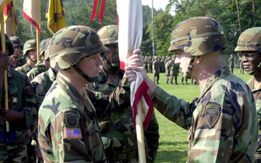 Gen. B.B. Bell, U.S. Army Europe commander, hands over command of the 21st Theater Support Command to Brig. Gen. Scott G. West, left., during a Thursday ceremony.