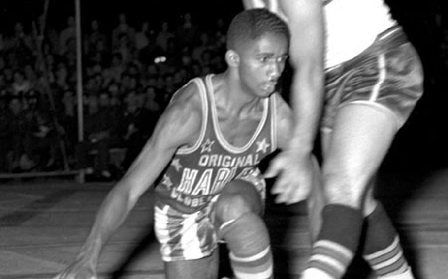 Marques Haynes shows off his legendary dribbling during the Harlem Globetrotters&#39; game at Munich. Germany, in August, 1951.