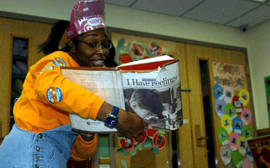"Penelope" reads a book about feelings to a group of pre-schoolers Friday morning at the Child DevelopmentCenter on Yongsan. Penelope is a character played by Sarah Gibbs, a victims' advocate for the Family Advocacy Agency at Yongsan.