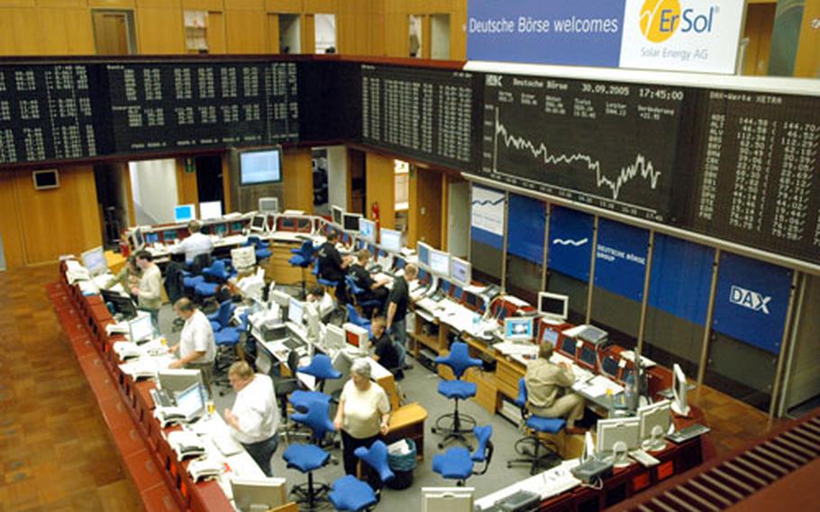 The floor of the Frankfurt stock exchange, with its "big board", the Dax, at right. The computerized Xetra Dax closes at 5:30 p.m., but trading goes continues on the floor until 8 p.m.