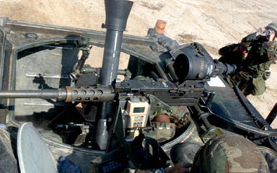 A Troops C, 4th Squadon, 7th Cavalry Regiment mortar fires at Rodriguez Range on Thursday.