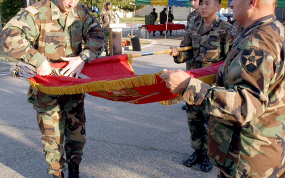 5th Battalion, 5th Air Defense Artillery Regiment Commander Lt. Col. Dan Sauter and 5-5 Command Sgt. Maj. John Mattie case the battalion colors at Camp Sears on Wednesday.