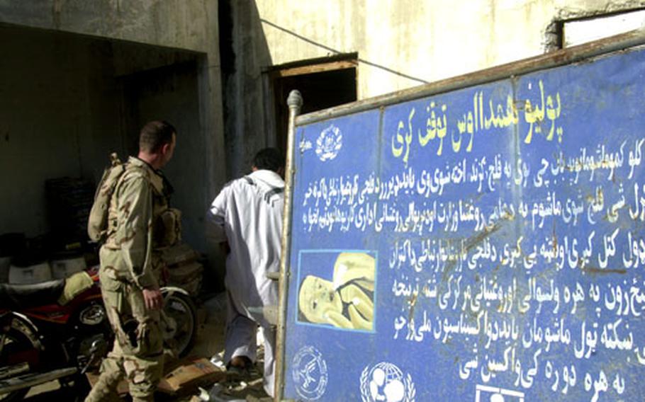 U.S. Air Force Capt. Todd Tarner, a physican assistant with the Asadabad provincial reconstruction team, enters the Asadabad Central Hospital’s pharmacy Wednesday afternoon in Afghanistan.