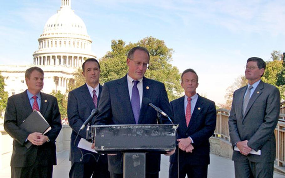 Rep. Mike Conaway, R-Texas, speaks during a news conference Wednesday about military chaplains’ right to use Christian imagery and verses in their public remarks. With him are, from left, Rep. Mike McIntyre, R-N.C.; Rep. Trent Franks, R-Ariz; Rep. Todd Akin, R-Mo.; and Rep. Jim Ryun, R-Kansas.