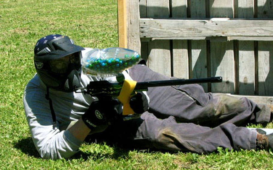 A paintball player goes to the ground during a recent match.