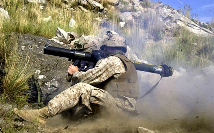 Cpl. William Davidson of 2nd Battalion, 3rd Marine Regiment fires an MK-153 shoulder-launched multipurpose assault weapon during target practive Tuesday afternoon at Camp Blessing in eastern Afghanistan.