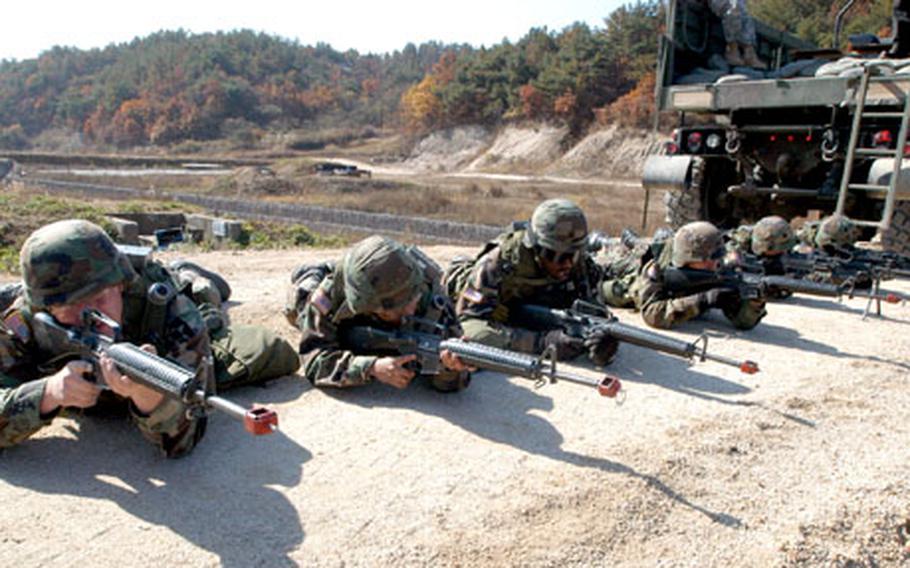 Company A, 602nd Aviation Support Battalion soldiers line up targets.