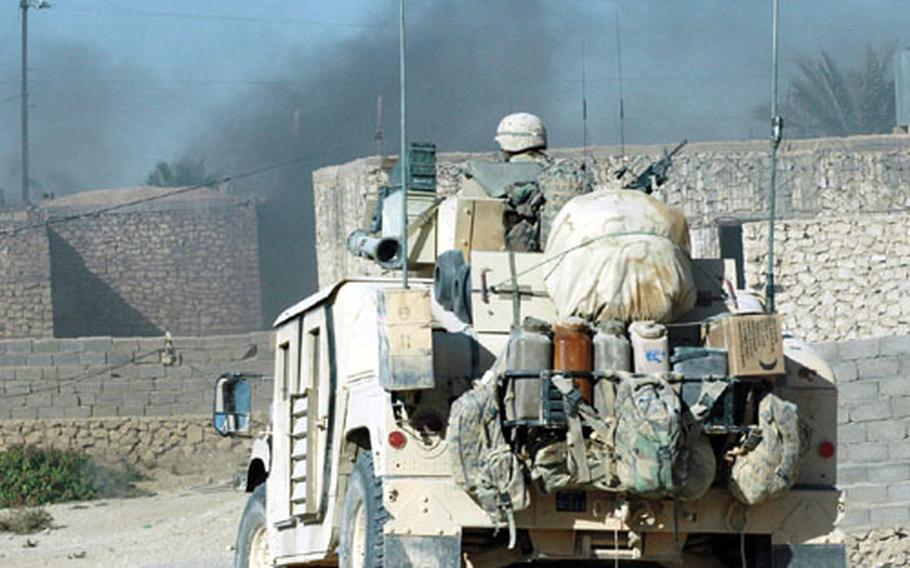U.S. Marines sweep through the city of Husaybah as part of Operation Steel Curtain.