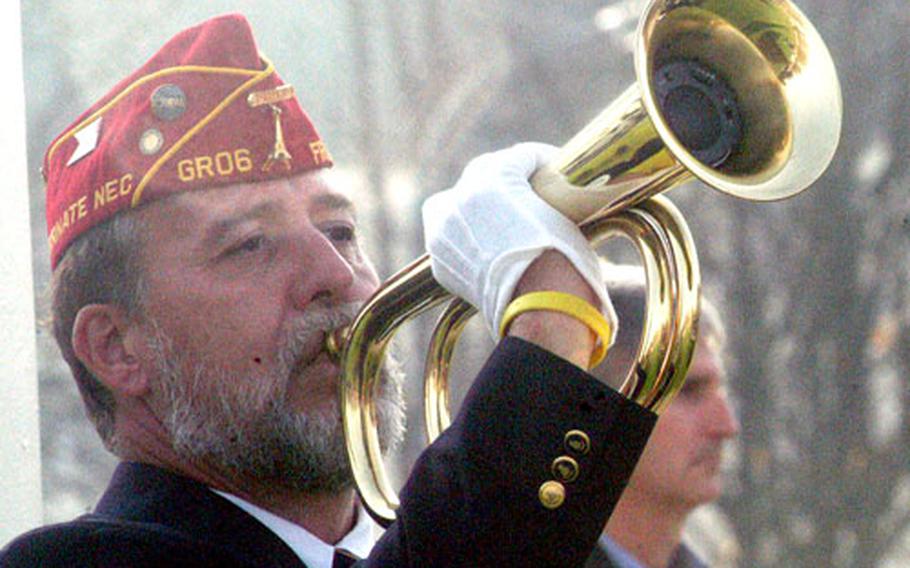 Michael Umland of American Legion Post 6 plays taps during a Veterans Day observance on Friday at Patch Barracks in Stuttgart, Germany.