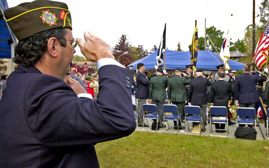 Mike Stephens, senior vice commander of the Veterans of Foreign Wars Department of Pacific Area III, salutes Friday as the colors are presented during a Veterans Day ceremony on Yongsan Garrison, South Korea.