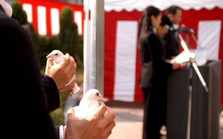 White doves await their release during the Verny-Oguri Memorial Ceremony on Sunday in Yokosuka, Japan.