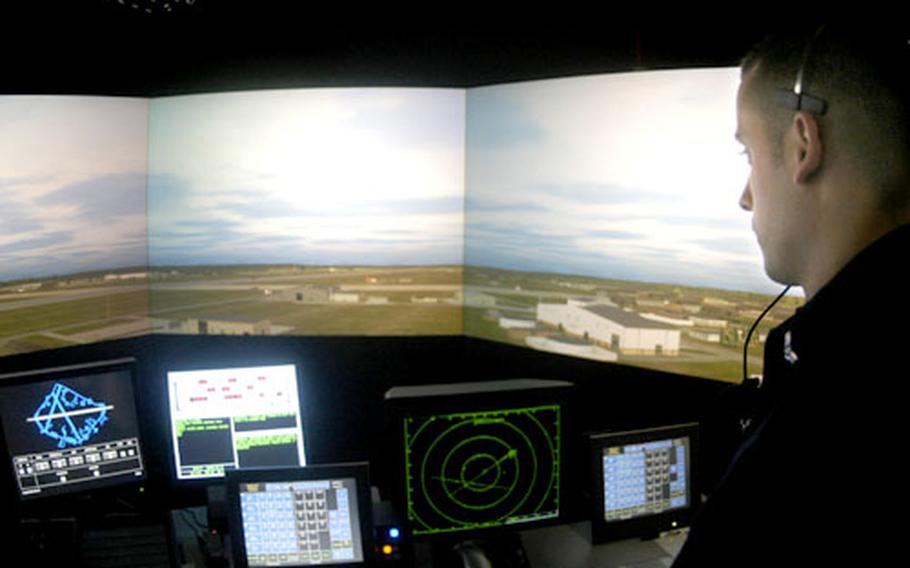 Air traffic controller Airman 1st Class Felix Rodriguez looks over “tower” displays at RAF Lakenheath’s new $1 million simulator. This mock air traffic control tower allows airmen to train on simulated emergencies either on the ground or in the airspace within five miles of the base.