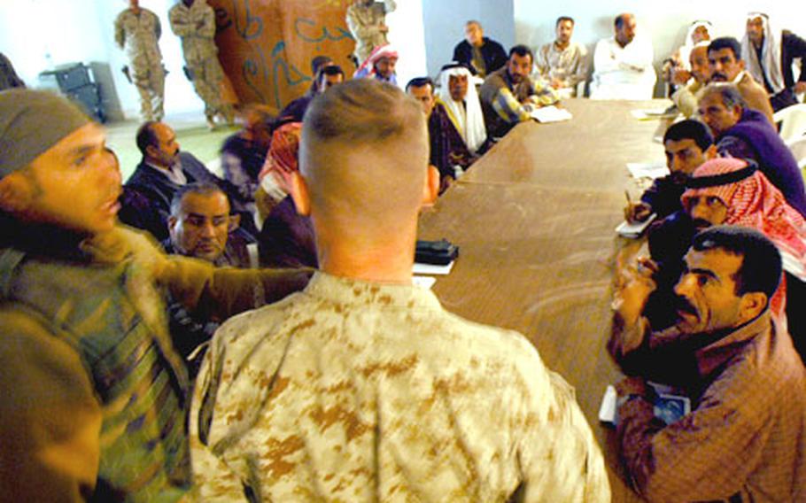 Iraqis voice concerns to Maj. Sean Hurley during the first meeting between U.S. Marines and local leaders after the battle of Husaybah last week.