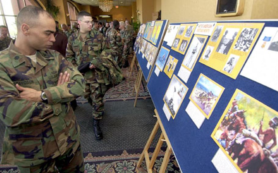 Lt. Col. James Davidson looks at displays during a National American Indian and Alaska Native Heritage Month commemoration ceremony Wednesday at the Dragon Hill Lodge on Yongsan Garrison, South Korea.
