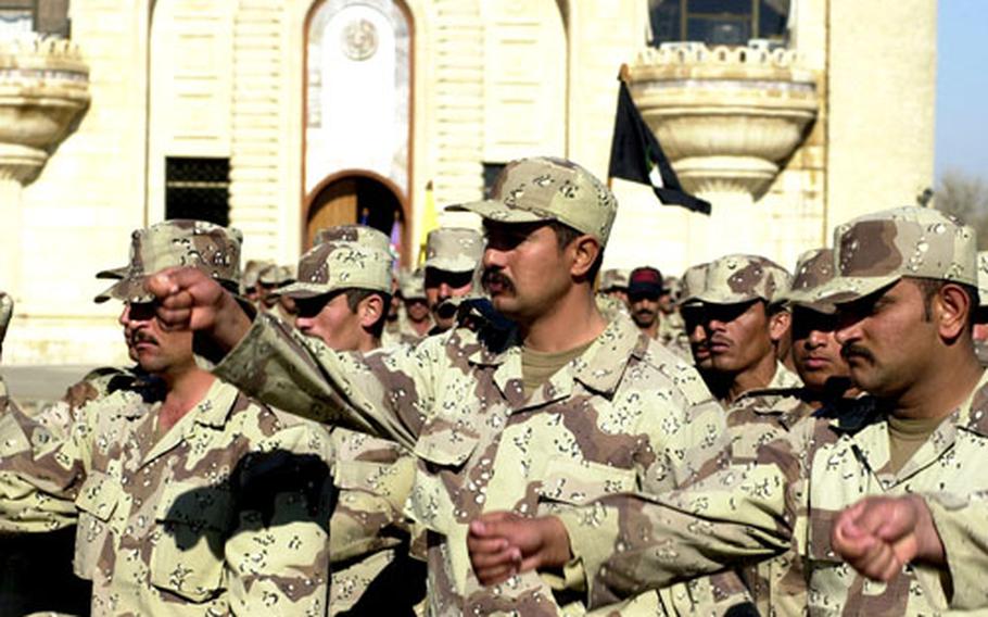 Iraqi troops take part in a graduation ceremony in January at Forward Operating Base Danger. U.S. forces will officially hand over the base to the Iraqi government Tuesday.