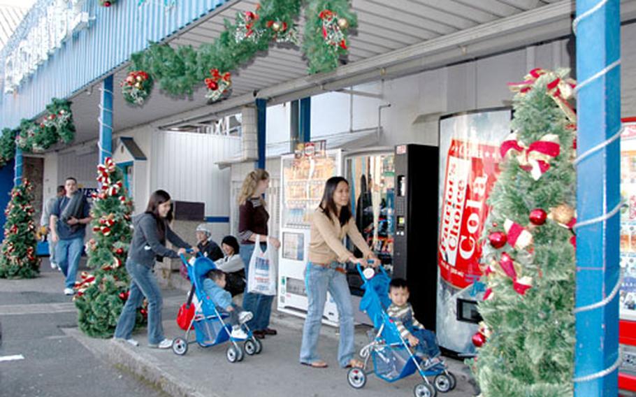 The Navy Exchange at Sasebo Naval Base, Japan, is already decked out with Christmas decorations, and soon much of the rest of the base will be decorated with bright lights, figurines, holly and candy-cane ribbon.