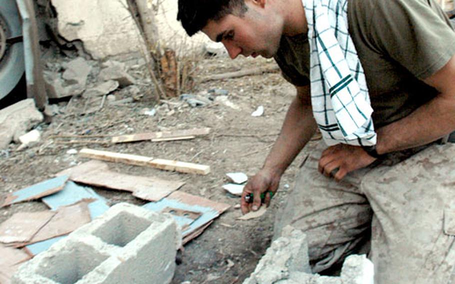 Pvt. Jake Lybrook worked at his Marine base in Husaybah, Iraq, near the Syrian border, while the other American men voted the nation's 50 most eligible bachelors by Cosmopolitian magazine partied in New York City.
