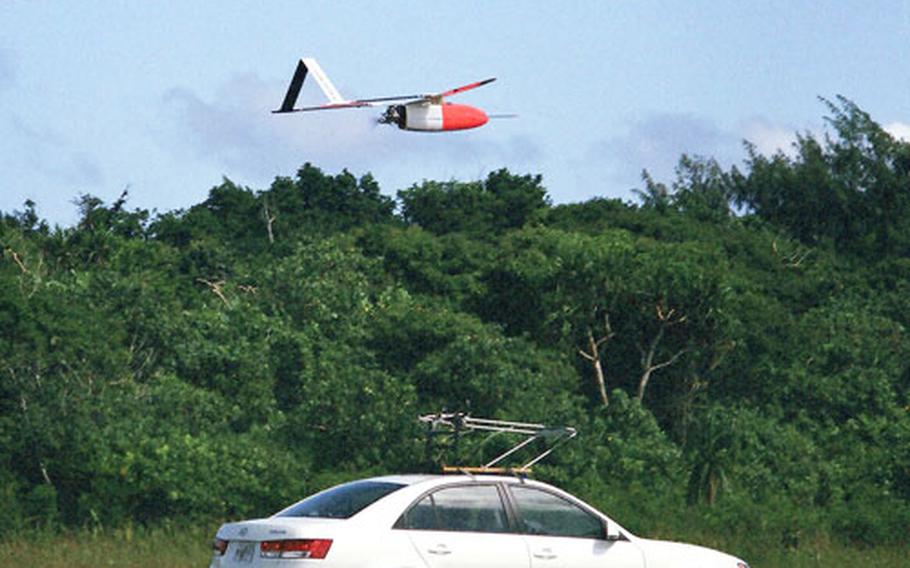 The Weatherscout unmanned aerial vehicle lifts off its launch vehicle for a test flight Oct. 18.