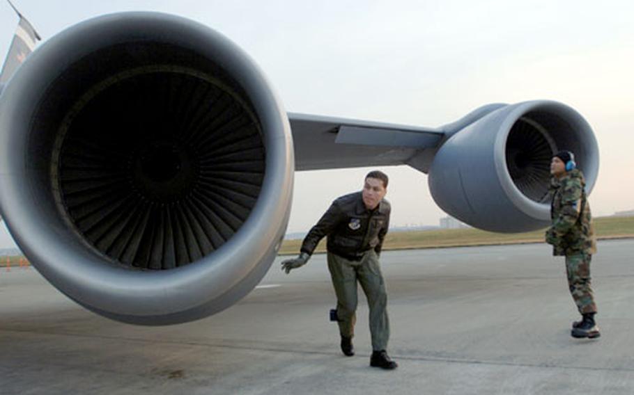 KC-135 Stratotanker pilot Capt. Brian Burr, left, preflights his aircraft with crew chief Senior Airman James Taimanglo. Tokyo’s High Court on Wednesday rejected demands by Japanese to extend no-fly hours for Yokota Air Base, Japan.