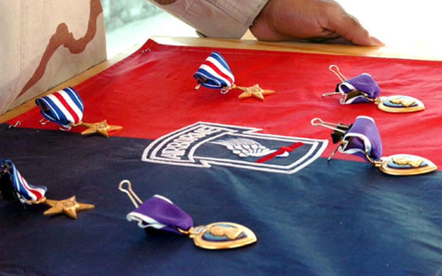 Three Silver Stars and three Purple Hearts are prepared for presentation to soldiers from the 173rd Airborne Brigade prior to an awards ceremony held Nov. 30 at Kandahar Airfield, Afghanistan.